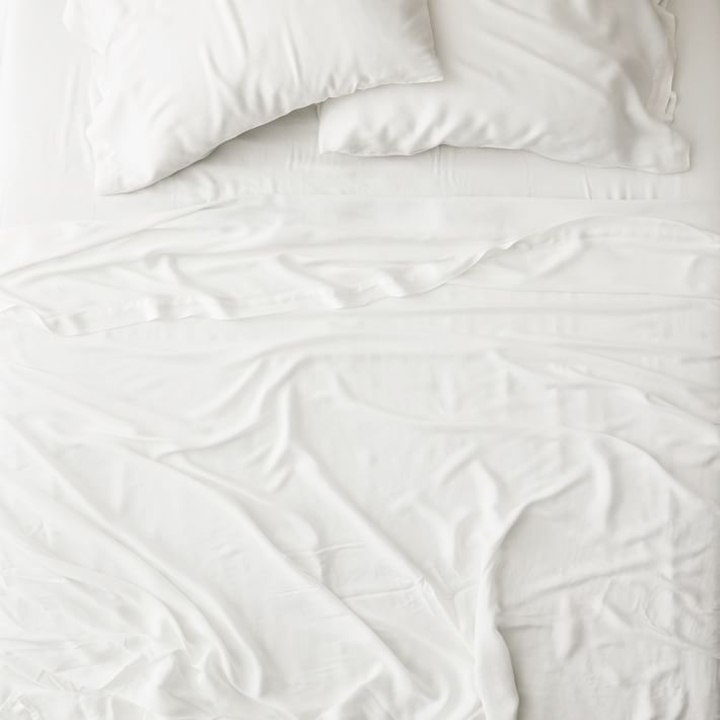 White sheets with two pillows.