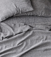 Gray bed sheets.