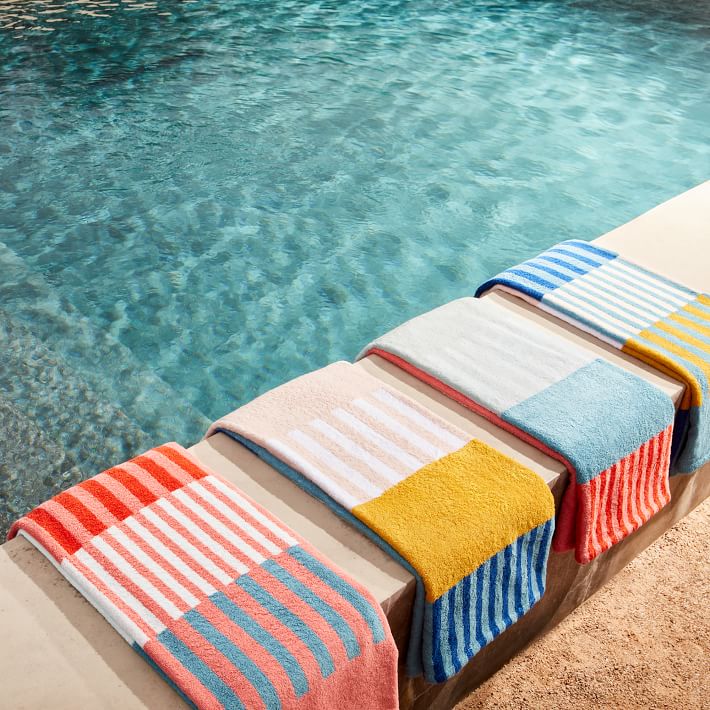 https://assets.weimgs.com/weimgs/ab/images/wcm//products/202338/0026/organic-collage-stripe-beach-pool-towel-poppy-o.jpg