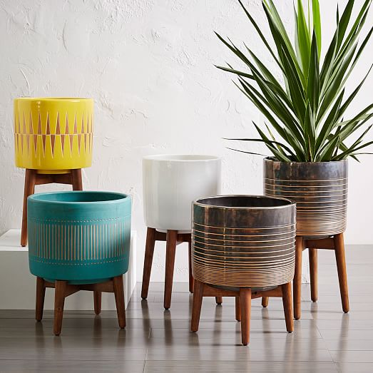 Shop Mid-Century Turned Wood Leg Planters - White & Gold from West Elm on Openhaus