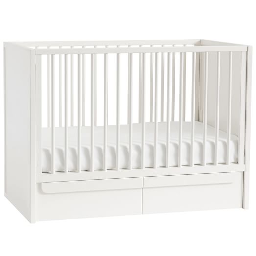 white crib with bow