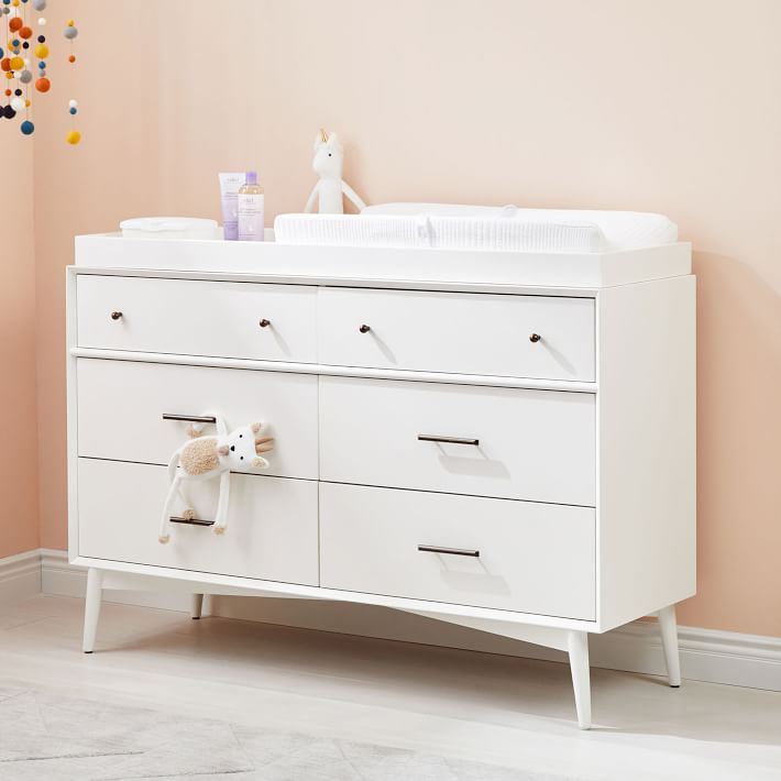 white dresser and changing table