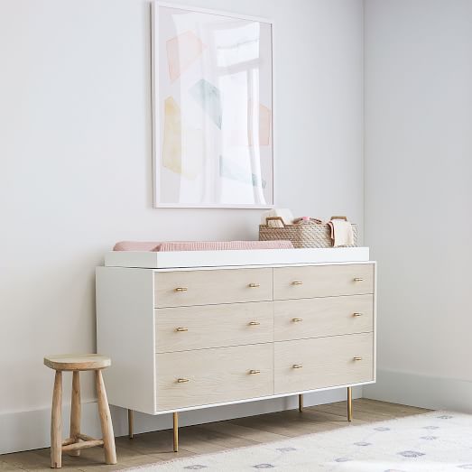 white changing table with drawers