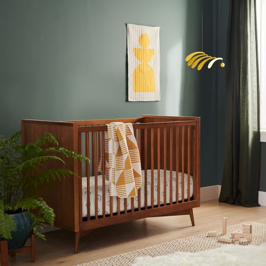 light wood crib and dresser