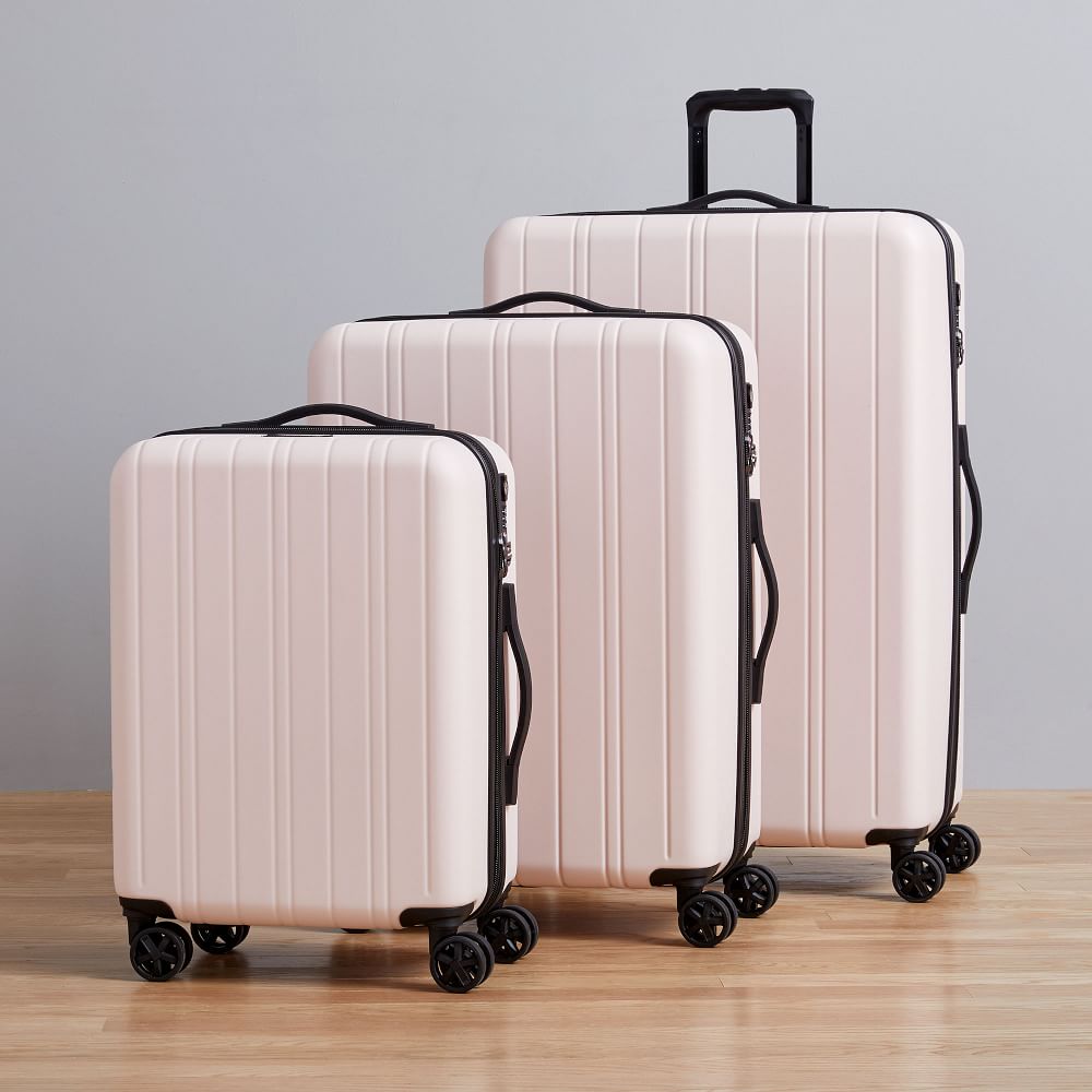 dusty pink luggage