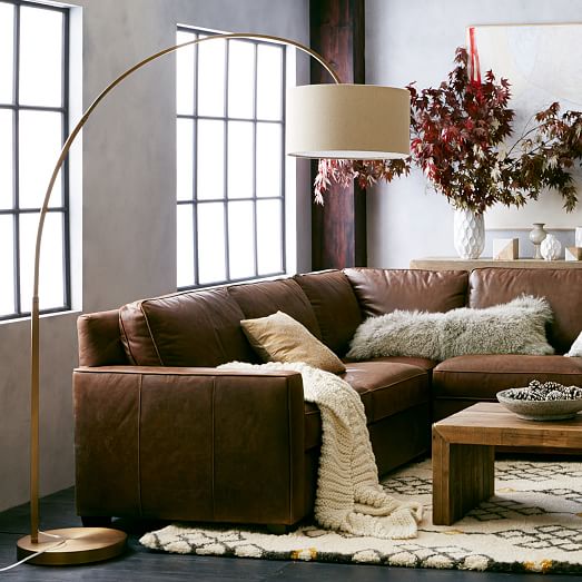 arc floor lamp behind sectional