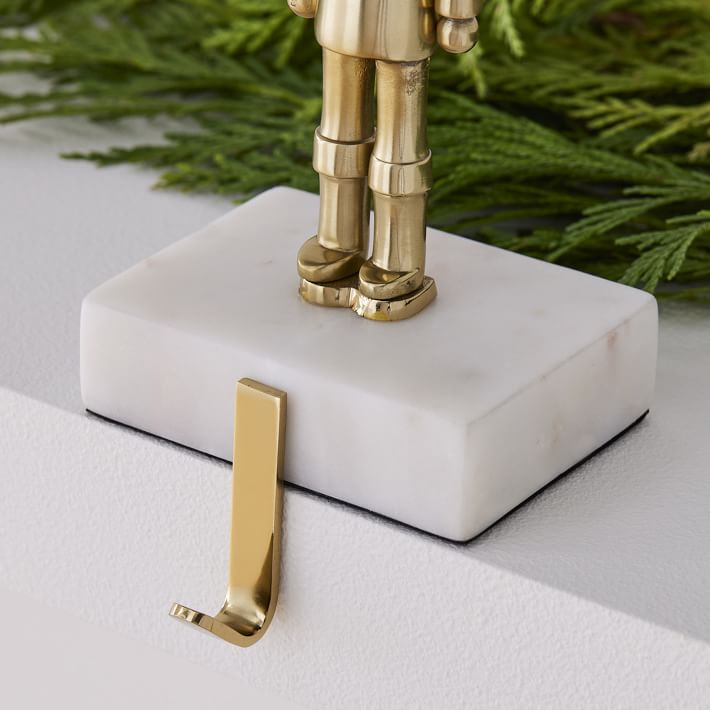 Brass & Marble Nutcracker Stocking Holder West Elm
