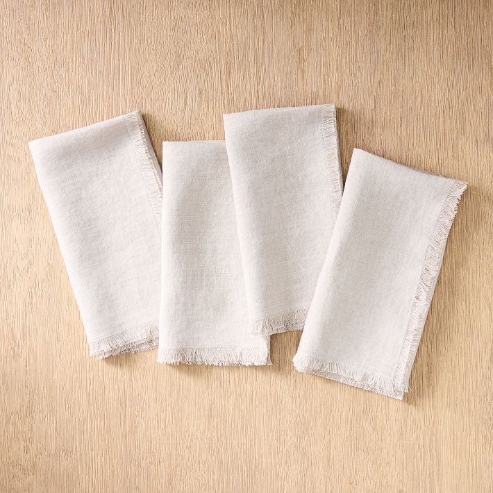 https://assets.weimgs.com/weimgs/ab/images/wcm/products/202336/0052/frayed-edge-linen-napkin-sets-1-o.jpg
