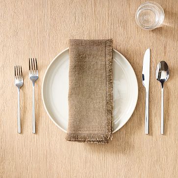 https://assets.weimgs.com/weimgs/ab/images/wcm/products/202336/0056/frayed-edge-linen-napkin-sets-m.jpg