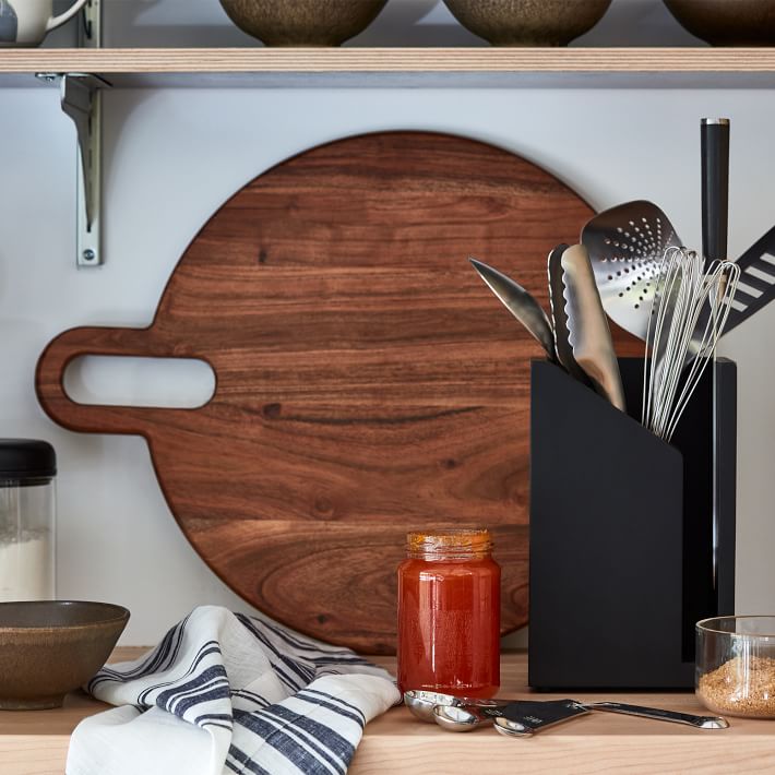 Set of kitchen ceramic tableware and wooden cutting boards on a table. Eco  style home still life. Stock Photo by Edalin