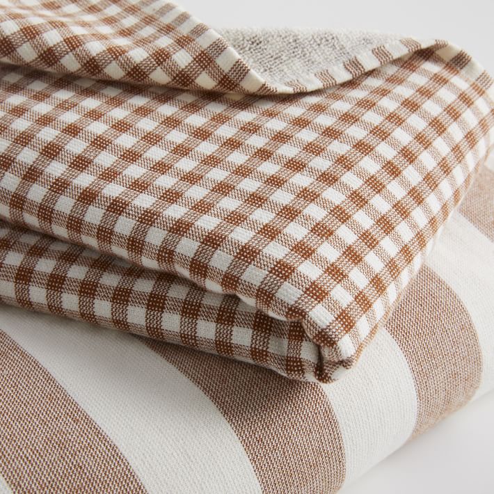 https://assets.weimgs.com/weimgs/ab/images/wcm/products/202342/0056/heather-taylor-home-stripe-gingham-towels-nutmeg-1-o.jpg