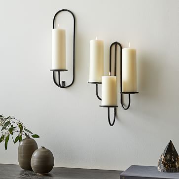 Bronze candle store wall sconce