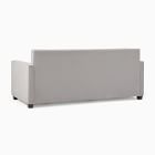 Back view of light grey sofa showing low profile and back panel