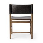 Close-up of a chair back with black leather panel attached to a wooden frame