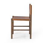 Side view of a wooden chair with tan leather seat
