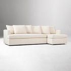 Sectional sofa with chaise and pillows in living room setup
