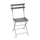 A gray metal folding chair with slatted seat and backrest