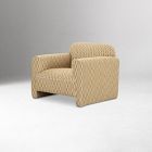 Front-right view of a small beige woven armchair with curved back and cushioned seat.