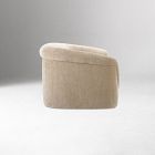 Side view of a beige upholstered compact end piece/ottoman without back, on white background.