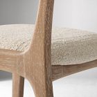 Close-up of beige fabric on seat and wooden frame