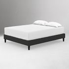 Black platform bed with white mattress and two pillows