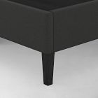 Close-up of single bed leg showing angled center support and fabric cover