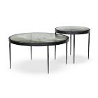 Two round tables with different heights and light marble tops