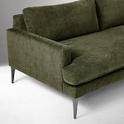 Close-up of olive green fabric upholstery and seam on sofa cushion