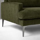 Front-left corner of olive green sofa showing leg and arm