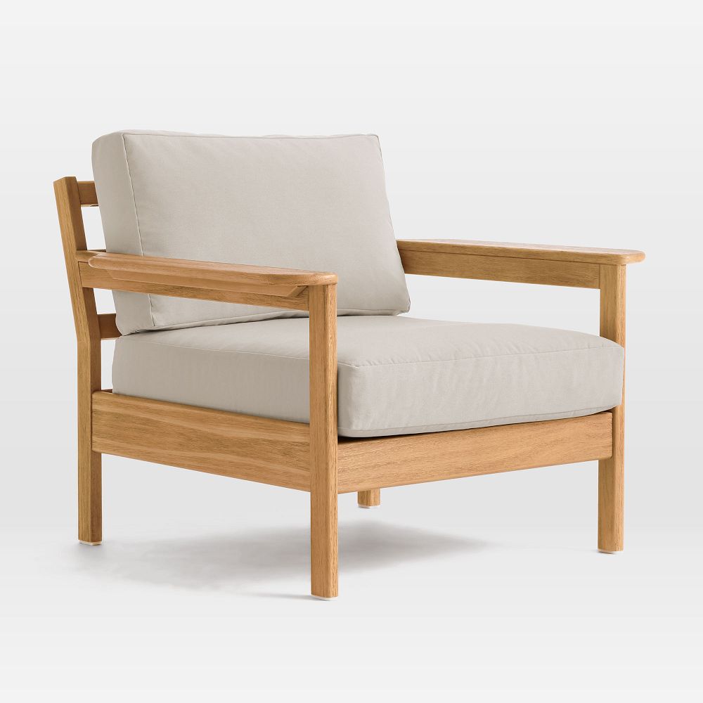 Wooden lounge chair with beige cushion.