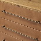 Two long horizontal metal handles on a wooden drawer front.
