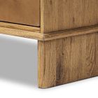 Corner of a wooden dresser/table leg showing finish