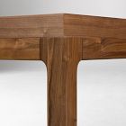Close-up of table leg intersection with the side rail and visible wood grain