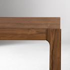 Joint area where table leg meets top with curved inset rail design