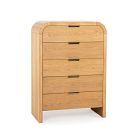 A light wood chest of drawers with five drawers and rounded top edges, standing on legs