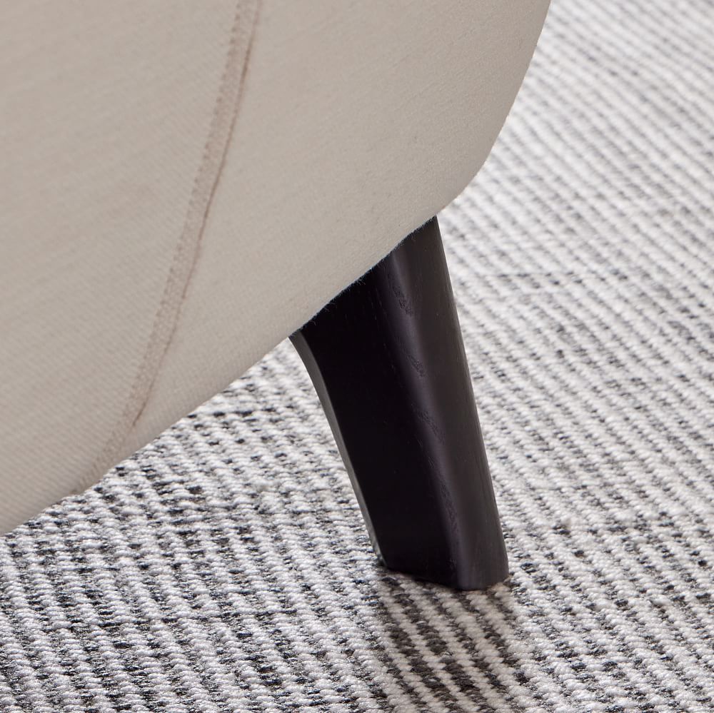 Chair leg and fabric near carpet