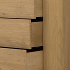 Close-up of a drawer front with a gap between drawers showing the pull-less design