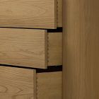 Jammed drawers partially open showing dovetail-like joints in wood