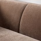 Close-up of the sofa rear/interior seam with brown fabric upholstery.