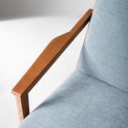 Close-up of armrest-to-seat junction with wooden frame and blue fabric