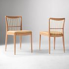 Two wooden chairs with cushioned seats, shown side by side.