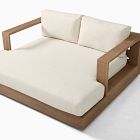 Low-profile wooden sofa with thick white cushions and wide armrest