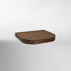Close-up of a wooden rounded-edge shelf floating