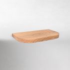 Small curved wooden shelf floating