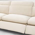 Close-up shot of cushioned beige sofa seat and backrest cushions