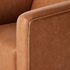 Close-up of the sofa edge with piping along the panel.