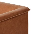 Close-up of the top edge and seam along the armrest of the chair.