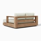 Wooden sofa with cream cushions and slatted back, two-tone look