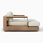 Wooden sofa with cream cushions and a small side pillow, side view