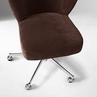 Close-up of chair seat and chrome base with casters